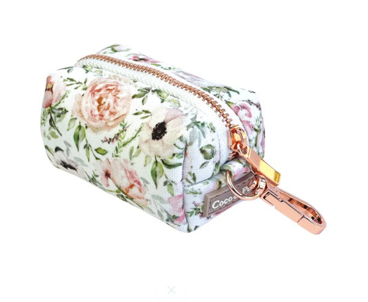 Floral patterned pouch with rose gold zipper and 'Coco' branding on a white background