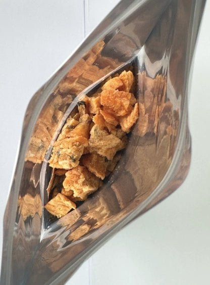 Shows the bag is nice and full of King Salmon treats for your cat.