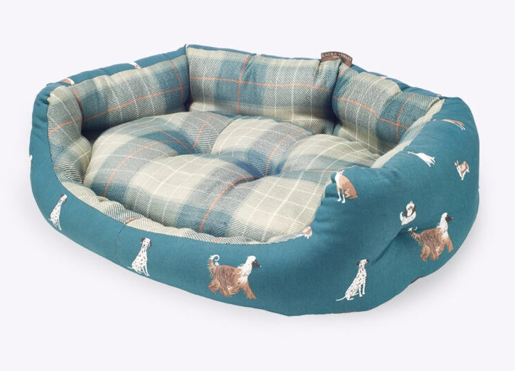 Teal pet bed with plaid pattern and dog illustrations on a white background