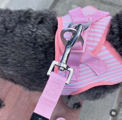 Its so easy to put on.  Simply pull over the velcro and pop your lead onto the two rings.
