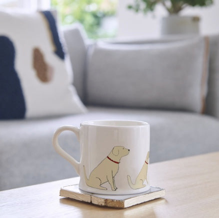 White ceramic mug with a Golden Retriever on it.