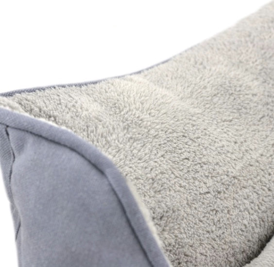 Dog bed with soft plush and cool cotton on the outside