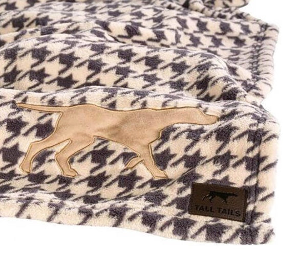 Dog blanket with a dog motif.